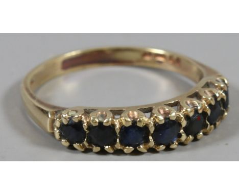 A 9 carat gold seven stone sapphire ring, size R 1/2. 