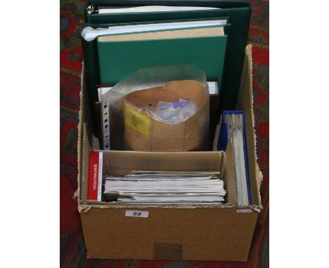 A box of stamp albums, first day covers and loose stamps.