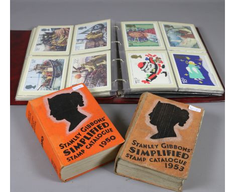 An album of first day cover themed post cards and two issues of Stanley Gibbons stamp catalogues.