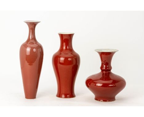 THREE CHINESE RED GLAZED PORCELAIN VASES
Including an amphora shaped example
The largest 42cm high
Condition: For a condition