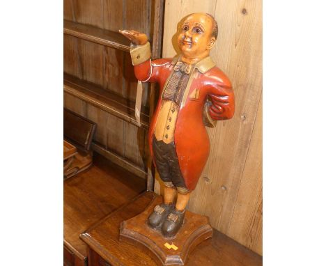 A reproduction painted wood model of a waiter, h.67cm