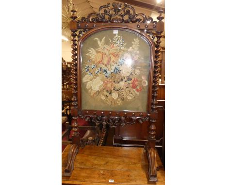 A mid-Victorian carved rosewood and floral needlework tapestry inset fire screen, w.68cm 