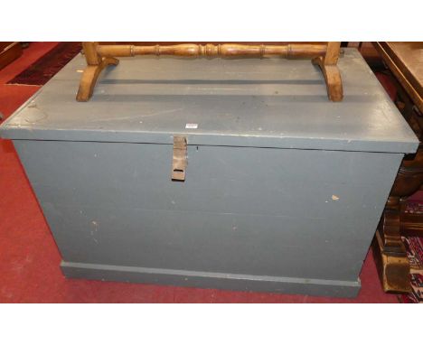 A large grey painted pine hinge top trunk, with iron end carry handles, w.115cm; together with a set of six moulded plastic c