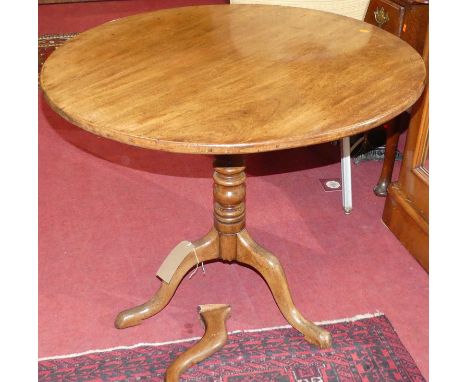 A 19th century mahogany circular tilt top pedestal tripod table (damage to one leg and requires restoration), dia. 85cm