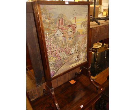 A 19th century mahogany and needlework inset fire screen, with opposing front and rear sliding panels, w.57.5cm 