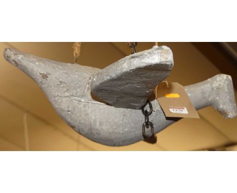 An early 20th century Folk Art painted wood model of a suspended bird, wingspan 93cm