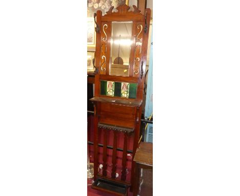 An Edwardian walnut and tile inset wall-mounted and mirrored inset hallstand, h.200cm, w.51cm