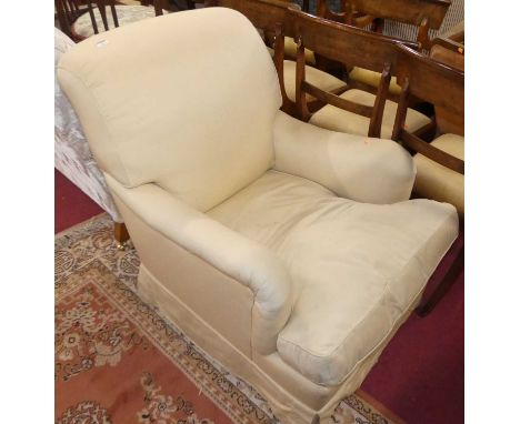 A contemporary Howard &amp; Sons fabric upholstered easy armchair, with removable squab cushion, raised on tapering supports 