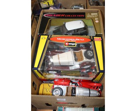 A collection of seven various boxed and loose 1/18 scale diecast vehicles to include a Bburago model of a Mercedes Benz SSKL