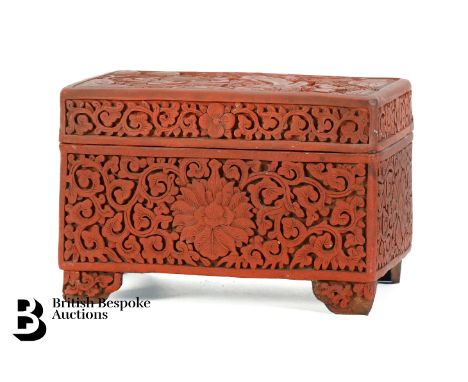 Antique Chinese Cinnabar box and cover. The sides of the box is intricately carved with foliate scroll, the top of the box is