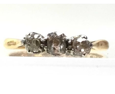 DIAMOND TRILOGY RING, platinum set with central diamond flanked by two smaller diamonds, on gold band, marks indistinct2.1g