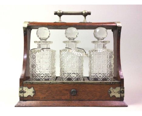 OAK THREE BOTTLE TANTALUS. with key34cm high