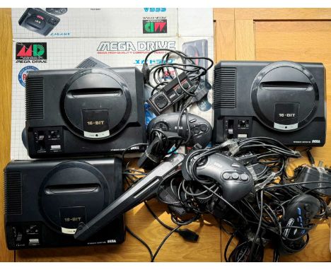 COLLECTION OF VINTAGE SEGA CONSOLES AND ACCESSORIES, comprising three Mega Drive consoles, various controllers, a Mega Drive 