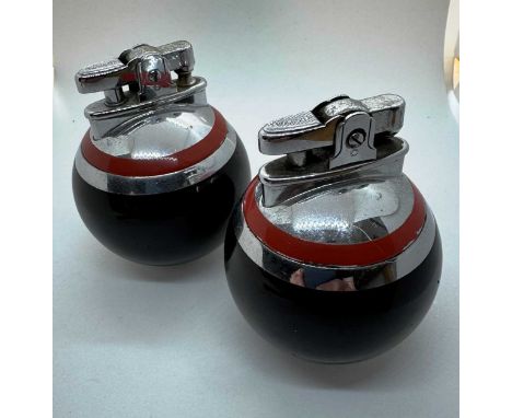 PAIR OF ART DECO RONSON TABLE LIGHTERS, EARLY / MID 20TH CENTURY each a Ronson Rondolite "Billiard ball" lighter, with black 