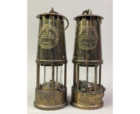 THREE MINERS LAMPS, comprising two brass examples bearing makers name for The Protector Lamp &amp; Lighting Co Ltd, along wit