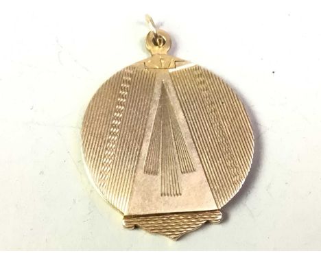 NINE CARAT GOLD LOCKET, of circular form, with engine turned decoration, inscribed to reverseQty: 8g