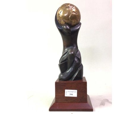 WORLD TRAVEL AWARDS TROPHY, the figure cast in bronze, raised on a wooden plinth33.5cm high