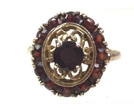 VICTORIAN BAR BROOCH AND A RING, the brooch set with rubies and a diamond, along with a garnet ring, each in nine carat goldS
