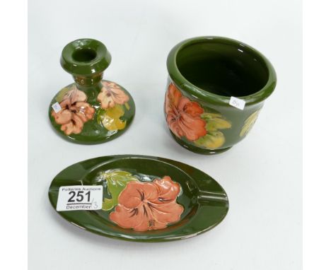 Moorcroft  Hibiscus on Green Ground items to include: small planter, candle stick, ashtray (3)