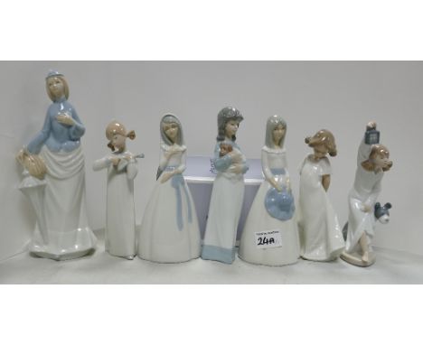 A collection of Lladro and Nao girl figurines: Lladro girl with guitar (4871), so shy ( 1109), My sweet Princess ( 1006973). 