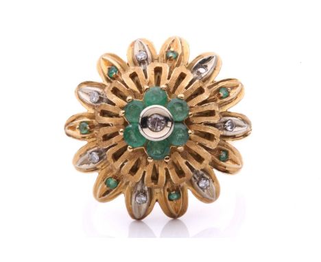 An emerald and diamond flowerhead dress ring, of bombé design, centred with a cluster of a single-cut diamond and six circula