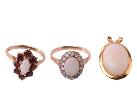 Two opal cluster dress rings and a pendant; comprising a 9ct gold cluster ring set with marquise opal cabochon encircled by r