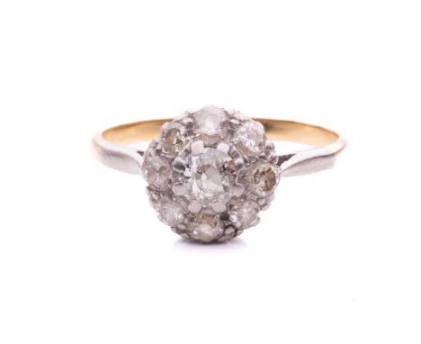 An old-cut diamond daisy head cluster ring, featuring a 4.5 x 4.5 x 2.4 mm old-cut diamond, encircled by eight smaller diamon