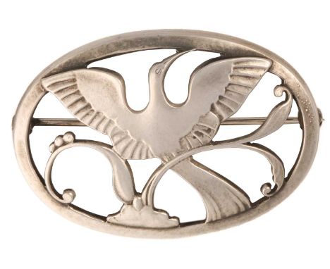 Georg Jensen - a Bird of Paradise openwork brooch, depicting a bird spreading wings amongst the foliage in an oval frame, hin