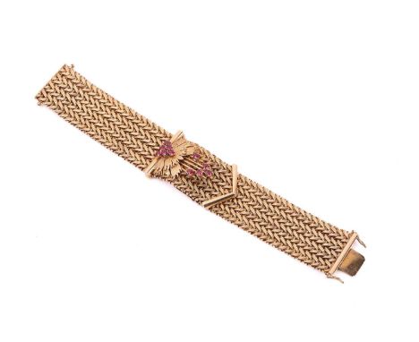 A synthetic ruby bracelet dating to circa 1968, the mesh bracelet designed as a buckle with floral spray decoration set with 