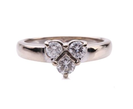 A three-stone diamond ring, containing three brilliant-cut diamonds arranged as the shape of a heart, with an estimated total