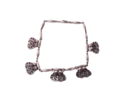 Georg Jensen - a fringe necklace set with amethyst, with five foliate pendants with patinated ground collet set with oval ame