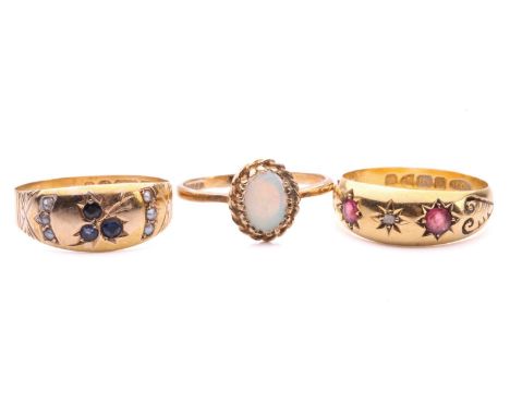 Three gem-set gold rings; including a star-set pink paste and diamond ring in 18ct gold, size M, Chester 1902; a 15ct gold gy