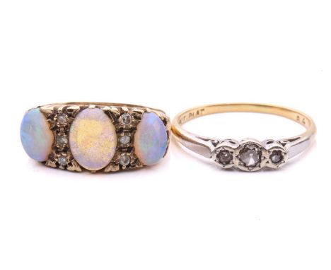 A three-stone opal dress ring and a diamond trilogy ring; the dress ring in 9ct gold, set with three graduated opal cabochons