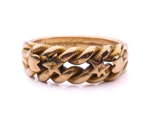 A dress ring in 18ct yellow gold, of twisted rope design, with applied stars and hearts motifs, to conjoined shank, Chester h