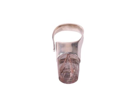 Georg Jensen - a dress ring set with a rutilated quartz, of bottle cork shape, composed of cylindrical quartz with reddish br