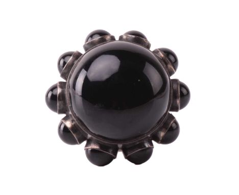 Georg Jensen - a large onyx cocktail ring, encircled with onyx cabochon ornaments around the collet, to a wide flat shank, de