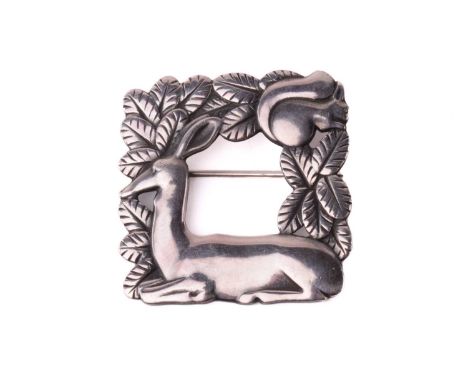 Georg Jensen - a square openwork brooch in silver, featuring a resting deer and squirrel in foliage, fitted with hinged pin s