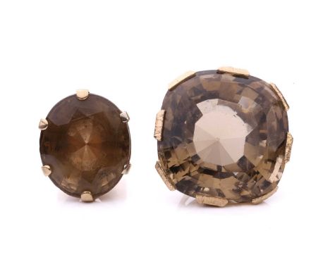 A large statement smokey quartz ring and pendant, the ring set with an oval smokey quartz measuring 30mm x 27mm x 18mm to a t