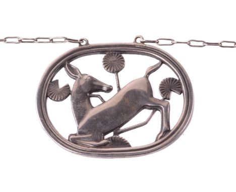 Georg Jensen - a necklace with kneeling fawn and flowers, attached to a cable chain and toggle clasp, designed by Arno Malino