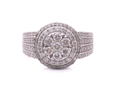 A diamond-set cluster ring in 18ct white gold, centred with a cluster of seven brilliant-cut diamonds, surrounded by two tier