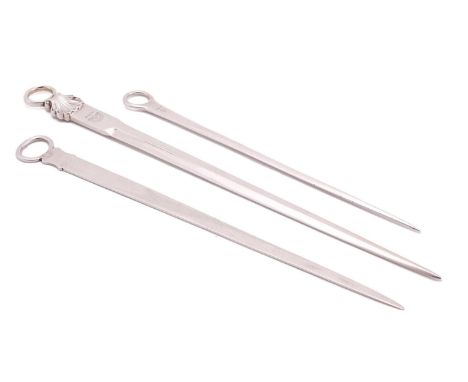 Three George III meat skewers; one with crest engraved below shell mounted ring terminal, London 1816 by William Eley I &amp;
