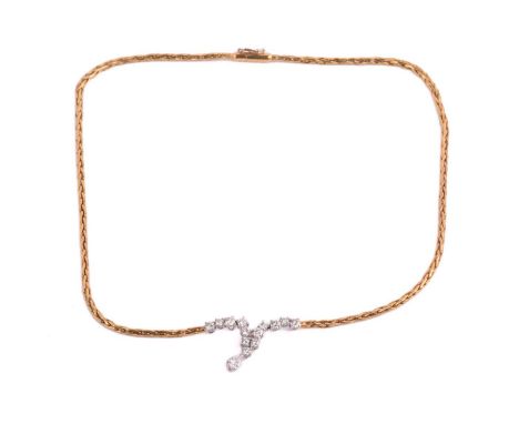 A diamond-set chevron necklace, the V-shaped pendant contains thirteen round brilliant-cut diamonds in articulated claw mount