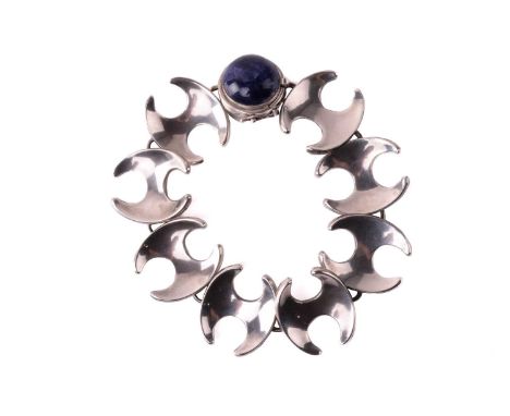 Georg Jensen - a bracelet with eight concave links of stylised 'H' form, connected to a circular box clasp set with a sodalit