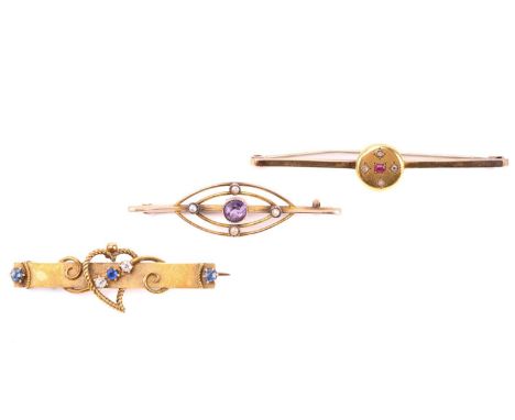 Three bar brooches, the first a Victorian example with a heart motif and set with diamond, sapphire and paste, hallmarked to 