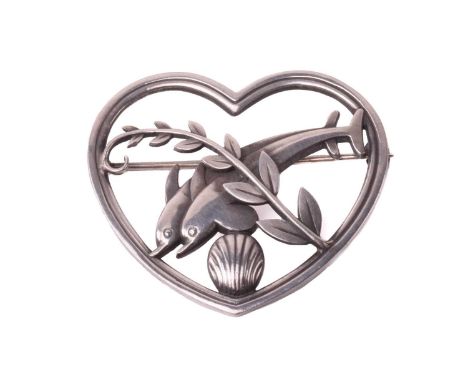 Georg Jensen - a 'double dolphin' brooch, depicting two dolphins leaping over a sea shell with a fern motif across in a heart