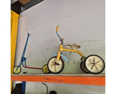 A raliegh tricycle and a scooter.