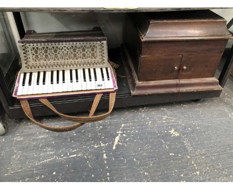 A vintage piano accordion by Estrella, Italia, and Concordia gramophone.