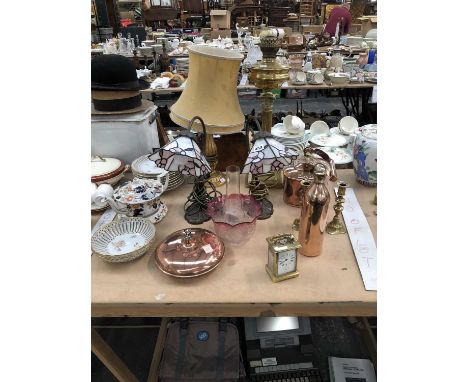 A pair of table lamps with leaded glass shades, an oil lamp, a carriage clock, copper wares and a part dessert set