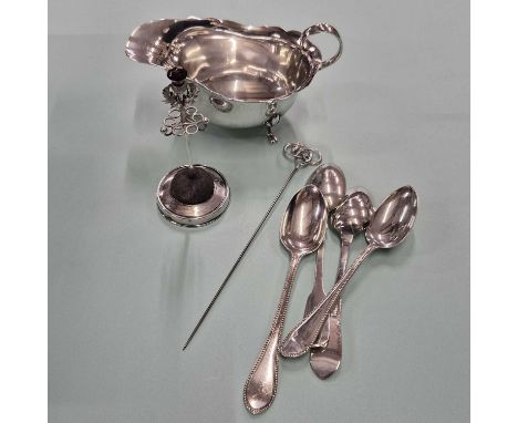 Hallmarked silver- a sauce boat, four spoons, and a loaded hat pin small stand with a silver topped hat pin. Gross weighable 