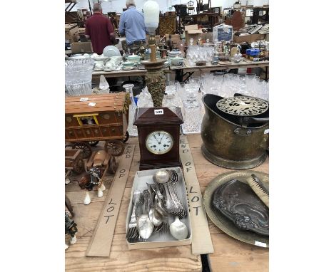 Electroplate cutlery, a mahogany cased clock and a table lamp
